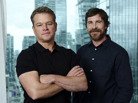 Matt Damon, left, and Christian Bale, cast members in the film "Ford v Ferrari," pose for a portrait at the St. Regis Hotel during the Toronto International Film Festival, Sunday, Sept. 8, 2019, in Toronto.