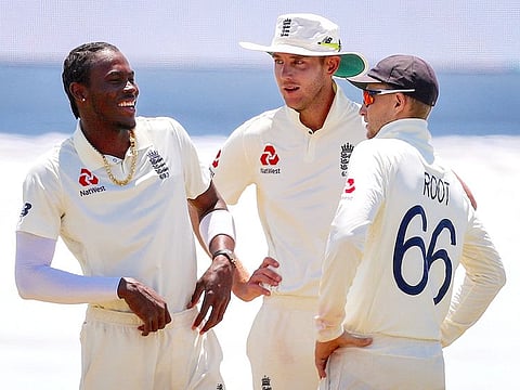 England’s captain Joe Root, right, with Stuart Broad and Jofra Archer.