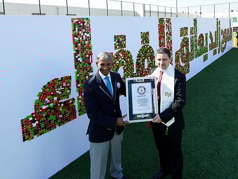 Pravin Patel (left) presenting Guiness World Records Certificate for the largest bottle cap sentance to principal Karm Murcia of GEMS Al Barsha National school for boys in Dubai on 26 November 2019. Photo: Virendra Saklani/Gulf News