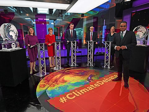 Krishnan Guru-Murthy, Liberal Democrat leader Jo Swinson, SNP leader Nicola Sturgeon, Plaid Cymru leader Adam Price, Labour Party leader Jeremy Corbyn and Green Party Co-Leader Sian Berry, stand next to ice sculptures representing the Brexit Party and Conservative Party who didn't appear at the event, before the start of the Channel 4 News' General Election climate debate at ITN Studios in Holborn, central London, Britain November 28, 2019.