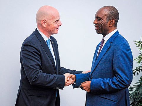 Gianni Infantino (L), the President of Fifa, is greeted by Carlos Agostinho do Rosario, the Prime Minister of Mozambique, at his office in Maputo on November 27, 2019.