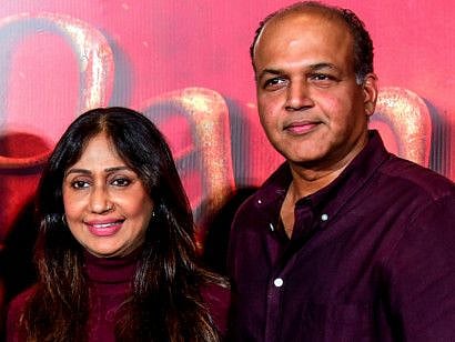 Bollywood film producer Sunita Gowariker and her husband director Ashutosh Gowariker pose for photographs as they attend the song launch of their upcoming Hindi film 'Panipat' directed by Ashutosh Gowariker in Mumbai on November 23, 2019.