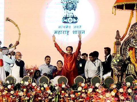 Chief Minister of Maharashtra Uddhav Thackeray waves to people after taking the oath in Mumbai on Thursday