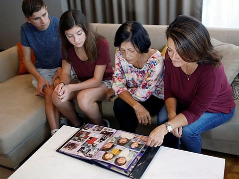 Nguyen Thi Dep takes a look at a photo album her daughter Leigh Boughton Small prepared for her, as they reunite after 44 years apart at Small's hotel suite in District 1, Ho Chi Minh City, Vietnam November 17, 2019. Nguyen gave up her 3-year-old daughter during "Operation Babylift" in 1975 before Saigon fell to Communist North Vietnam. Picture taken November 17, 2019. REUTERS/Yen Duong