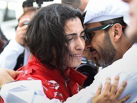 Team Abu Dhabi's Amna Al Qubaisi has tears of joy as she celebrates her moment of triumph with father Khaled Al Qubaisi on Saturday.