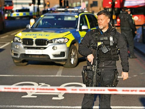 Police at the scene of an incident on London Bridge in central London following a police incident, Friday, Nov. 29, 2019. British police said Friday they were dealing with an incident on London Bridge, and witnesses have reported hearing gunshots. The Metropolitan Police force tweeted that officers were “in the early stages of dealing with an incident at London Bridge.