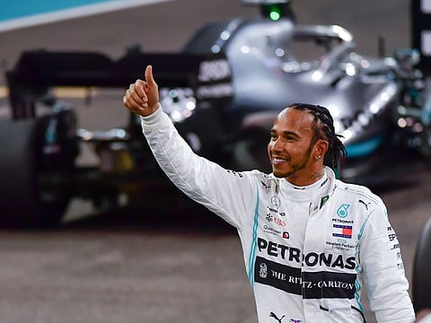 Six-time world champion Lewis Hamilton of Mercedes after securing the pole position for Sunday's Formula 1 Etihad Airways Abu Dhabi Grand Prix.