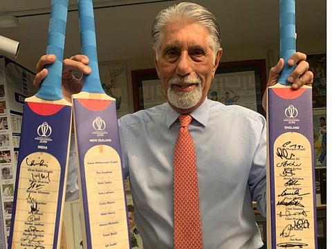 Shyam Bhaita with the World Cup 2019 teams autographed bats presented by the International Cricket Council to his museum.