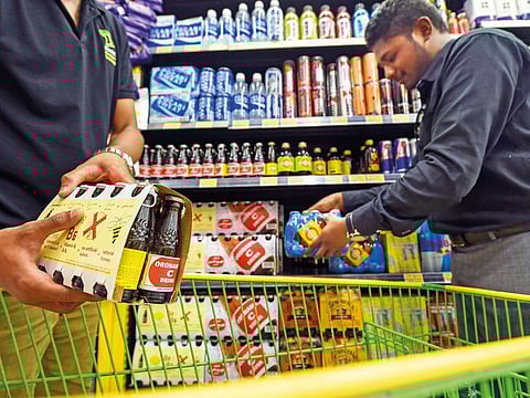 Customers buying energy drinks at a hypermarket in Dubai