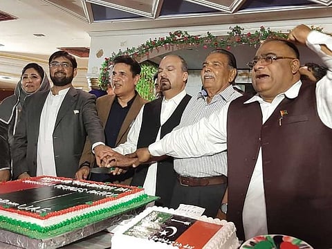 Pakistan Peoples Party supporters Khadim Shaheen (right), Syed Sajjad Shah, Mian Muneer Hans and Sardar Javed Yaqoob celebrating their party's 52nd foundation day and the 48th UAE National Day at a ceremony held in Sharjah.
