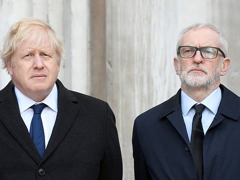 Britain's Prime Minister Boris Johnson and Britain's opposition Labour Party leader Jeremy Corbyn attend a vigil for victims of a fatal attack on London Bridge in London, Britain December 2, 2019. REUTERS/Toby Melville
