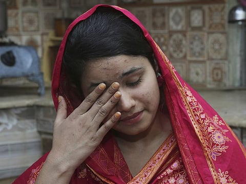 Pakistani Christian girl Mahek Liaqat, who married to a Chinese national, in tears while narrates her ordeal, in Gujranwala, Pakistan, in this April 14, 2019 file photo.