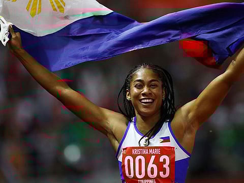 Philippines' Knott Kristina Marie celebrates after winning the women's 200m final.