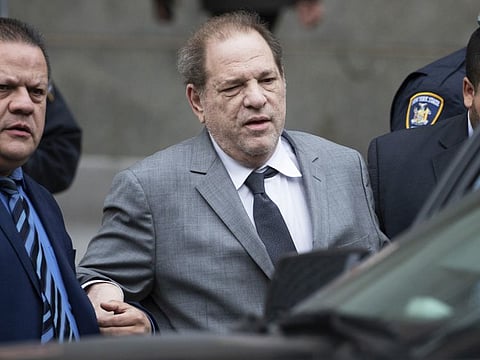 Harvey Weinstein, center, leaves court following a bail hearing, Friday, Dec. 6, 2019 in New York. (AP Photo/Mark Lennihan)