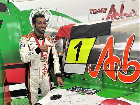 A beaming Rashed Al Qemzi of Team Abu Dhabi after their win on the home waters.