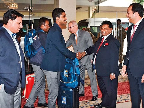 Members of the Sri Lankan team are being received by Noordeen Mohamed Shaheid, the Sri Lankan Commissioner to Pakistan, on Monday.