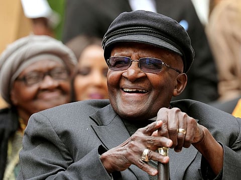 Archbishop Desmond Tutu laughs as crowds gather to celebrate his birthday by unveiling an arch in his honour outside St George's Cathedral in Cape Town, South Africa, October 7, 2017.