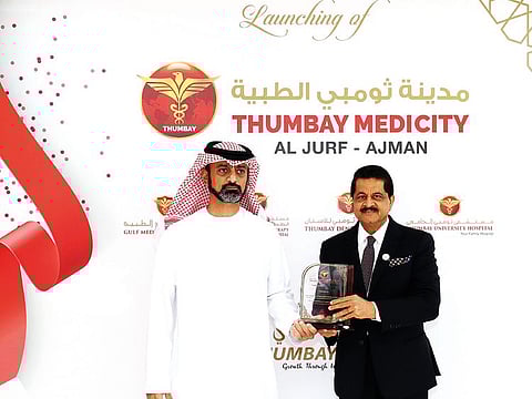 Shaikh Ammar being felicitated by Dr Thumbay Moideen at the Thumbay University Hospital inauguration.