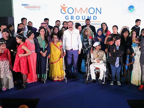Dr. Azad Moopen with differently abled children at the ‘Common Ground’ event hosted by Aster Volunteers to celebrate International Day of Disabled Persons at the Dubai Club for People of Determination