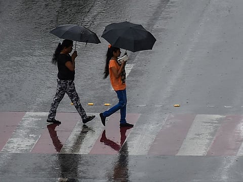 Residents caught in the rain in Sharjah on Tuesday 10 December 2019. Photo: Virendra Saklani/Gulf News