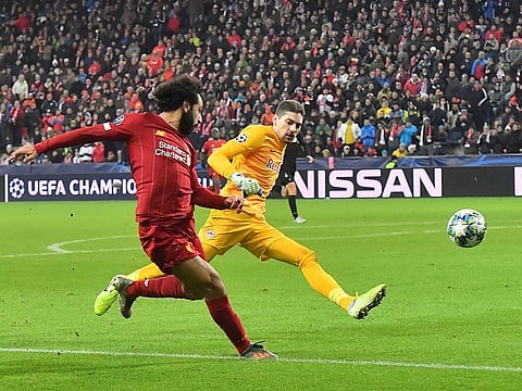Liverpool's Mohamed Salah scores.
