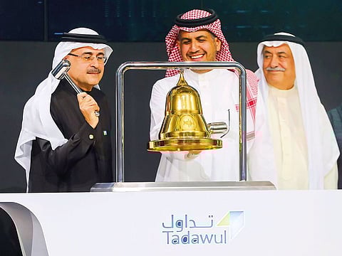Ameen Nasser, President and CEO of Aramco, ringing the bell during the official ceremony marking the debut of the company's shares on the Riyadh stock market.
