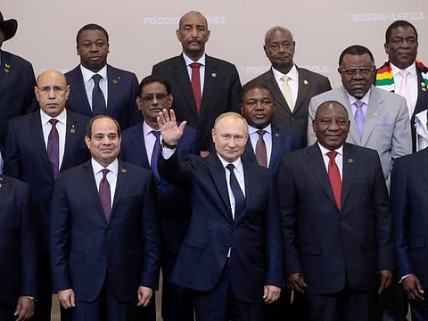 In this file photo taken on October 24, 2019 Russian President Vladimir Putin (C) gestures as Egypt's President Abdel Fattah al-Sisi (1st row, 2L) and South African President Cyril Ramaphosa (2R) pose for a family photo with African countries leaders attending 2019 Russia-Africa Summit and Economic Forum in Sochi. Russia reinvest into its old relationship with Mali in the name of fighting terror, as the security situation in the country is deteriorating despite the presence of about 4.500 French soldiers in the Sahel region. / AFP / Sergei CHIRIKOV