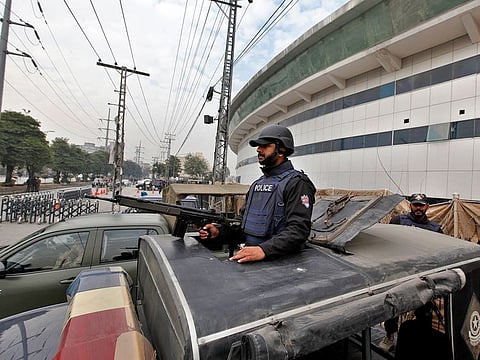 A police commando stands alert at a vehicle outside the Pindi Cricket stadium to ensure security ahead of first test match between Pakistan and Sri Lankan cricket teams in Rawalpindi, on Monday.
