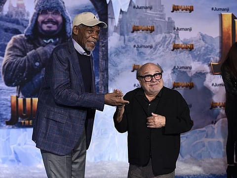 Cast members Danny Glover, left, and Danny DeVito arrive at the Los Angeles premiere of "Jumanji: The Next Level" at the TCL Chinese Theatre on Monday, Dec. 9, 2019 in Calif.
