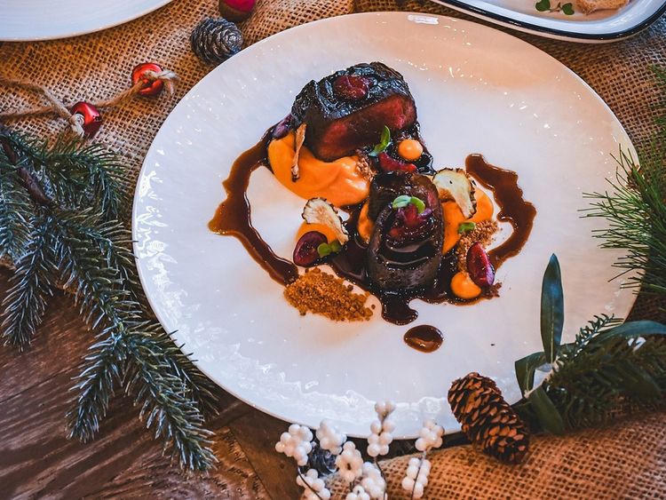While mainstays such as stuffed turkey roast and sausage rolls will always have a place at the Christmas table, restaurants like MasterChef, the TV Experience are shaking up traditional formulas. Venison saddle from MasterChef, The TV Experience