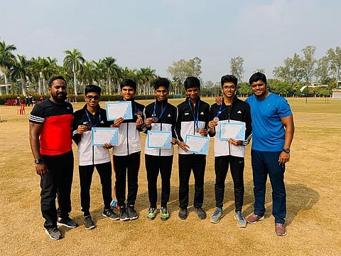 Our Own High School athletes and coaches with their awards after the CBSE National Athletic Meet.