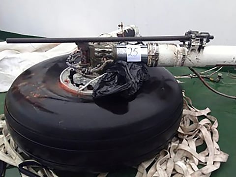 Handout picture released by the Chilean Air Force in Punta Arenas, Chile, on December 12, 2019, showing landing gear of the C-130 Hercules transport plane, which disappeared late Monday with 38 people on board, recovered from the sea by search teams.