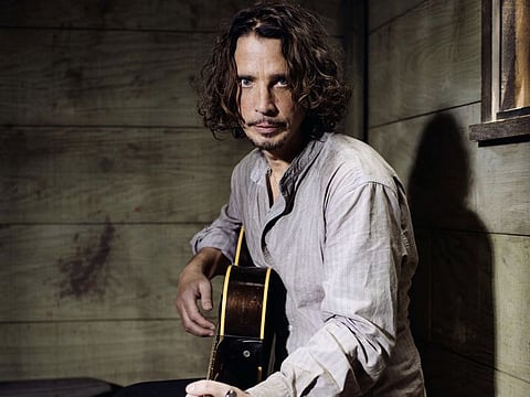 In this July 29, 2015 file photo, Chris Cornell plays guitar during a portrait session at The Paramount Ranch in Agoura Hills, California.