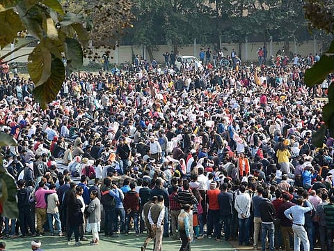 People assemble for a peaceful protest against the Citizenship Amendment Bill despite curfew, in Guwahati, Friday, Dec. 13, 2019