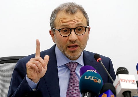 Lebanon's caretaker Foreign Minister Gebran Bassil gestures as he speaks during a news conference in Beirut, Lebanon December 12, 2019. REUTERS/Mohamed Azakir