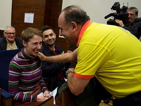 British Audrey Mash and her husband Rohan Schoeman speak with medical staff at Vall d'Hebron hospital in Barcelona, Spain, December 5, 2019. Picture taken December 5, 2019. REUTERS/Stringer NO RESALES. NO ARCHIVES.