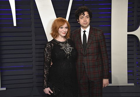 Christina Hendricks, left, and Geoffrey Arend arrive at the Vanity Fair Oscar Party on Sunday, Feb. 24, 2019, in Beverly Hills, Calif. (Photo by Evan Agostini/Invision/AP)