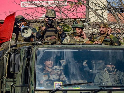 Army jawans conduct a flag-march in a locality during relaxation of curfew, in Dibrugarh, Friday, Dec. 13, 2019