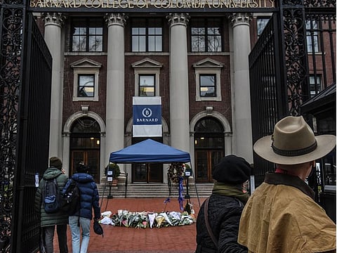 A memorial to murdered student Tessa Majors is covered by a tent on the Barnard College campus in New York on Friday, Dec. 13, 2019.