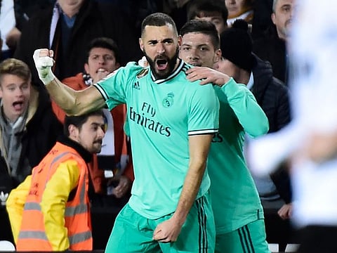 Real Madrid's French forward Karim Benzema celebrates.