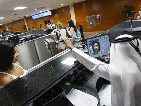 File photo of passengers during an eye scan on arrival at Passport Control area in Dubai International Airport.