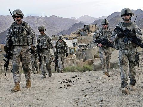 In this file image US soldiers depart Forward Operating Base Baylough, Afghanistan to conduct a patrol