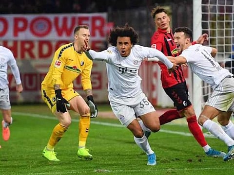 Bayern Munich scored two late goals against Frieburg.