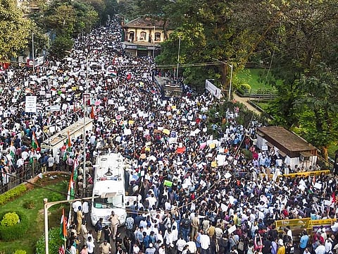 Protesters arrive to participate in a rally against the amended Citizenship Act and NRC, at August Kranti Maidan in Mumbai, Thursday, Dec. 19, 2019.