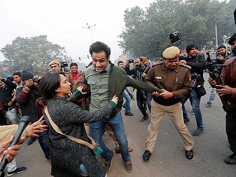 Police officers detain demonstrators during a protest against a new citizenship law at Red Fort in Delhi, India, December 19, 2019.