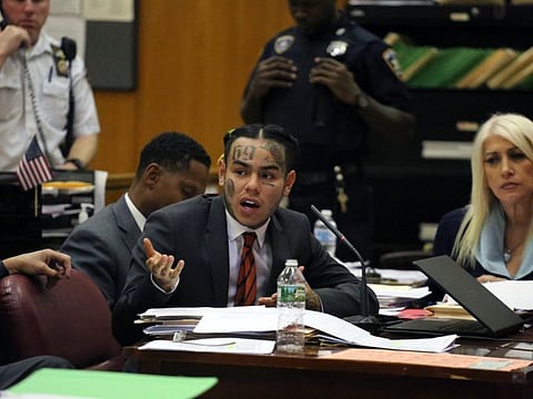FILE -- Daniel Hernandez, the rapper and Instagram star known as Tekashi69 as well as 6ix9ine, during sentencing in state Supreme Court in Manhattan, Oct. 26, 2018. Hernandez was sentenced to two years in prison on Wednesday, Dec. 18, 2019, by a federal judge who gave him credit for helping prosecutors send several of his former gang associates in the Nine Trey Gangsta Bloods to prison. (Jefferson Siegel/The New York Times)