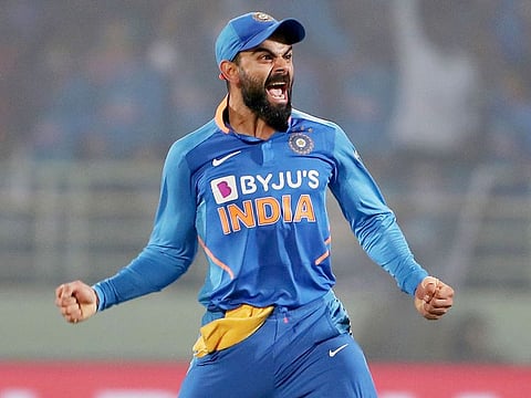 Indian skipper Virat Kohli celebrates the dismissal of Kieron Pollard during the second One-Day International cricket match against West Indies at Dr. YS Rajshekhara Reddy Cricket Stadium, in Vishakhapatnam on Wednesday.