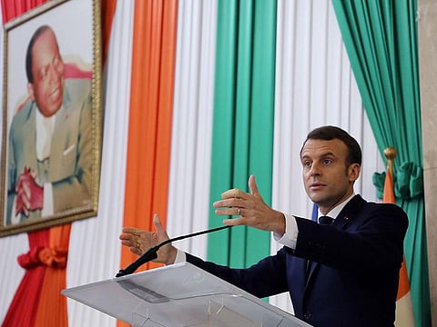 French President Emmanuel Macron delivers a speech during a ceremony to be named honorary citizen of the Abidjan Autonomous District