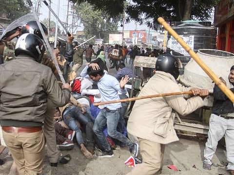 Police beat protesters during a demonstration against India's new citizenship law in Lucknow on December 19, 2019.