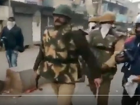 The video going viral on national media channels shows the cop walking to a corner with a firearm and a baton, before firing